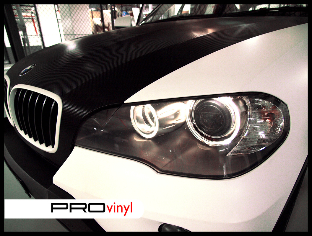 BMW X5 fully wrapped in matte white with carbon fibre bonnet | Sydney